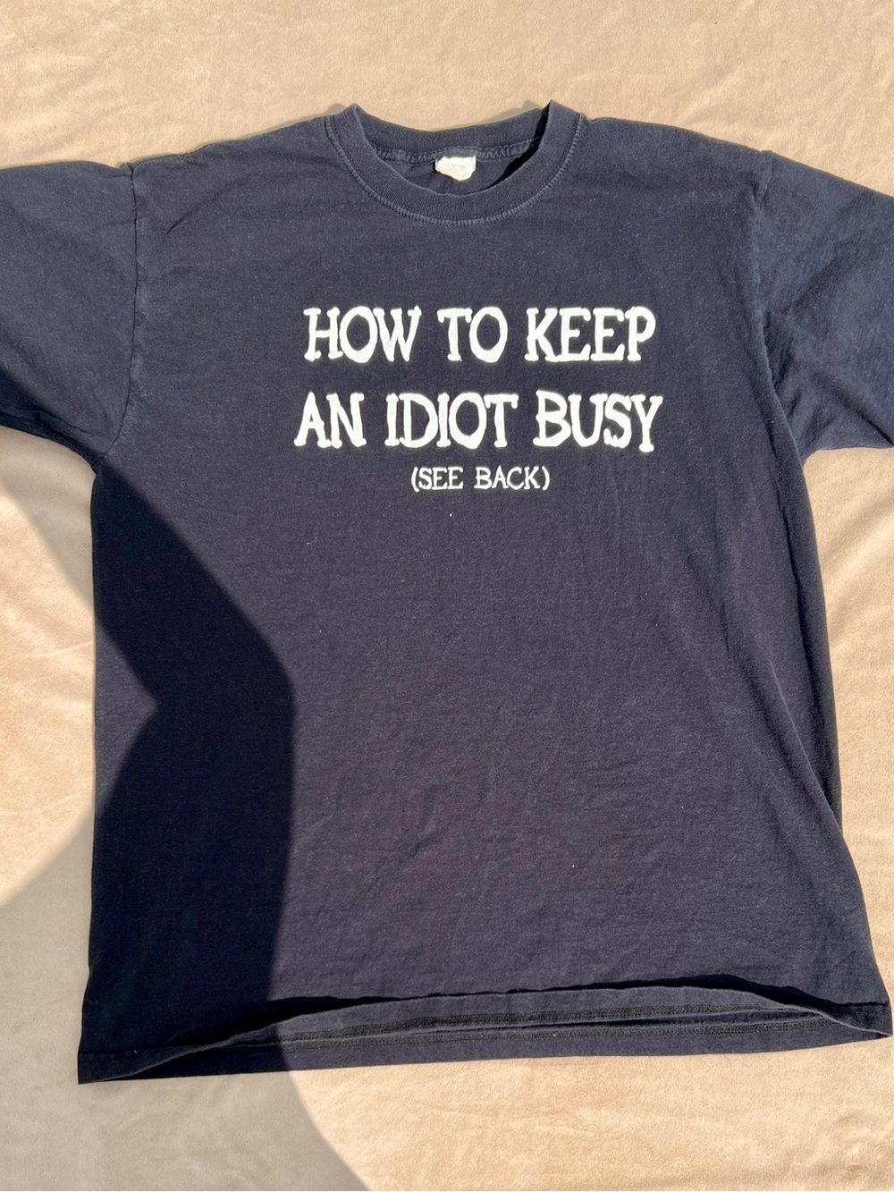 Jerzees Funny Graphic Tee "How To Keep An Idiot Busy" - Black with White Text